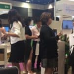 A group of people at a Intercorp Booth at SMEICC EXPO 2017, Suntec Convention Hall